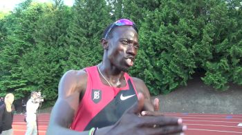 Lopez Lomong signs autographs after competing in 1500m