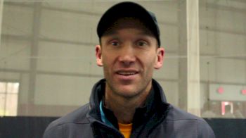Eau Claire coach Dan Schwamberger after a men's individual title and a women's 2nd place finish
