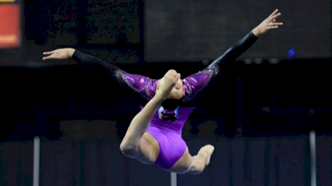 Kyla Ross in a leap on floor