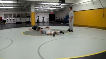 Tom Brands working with Ethen Lofthouse and Josh Haug